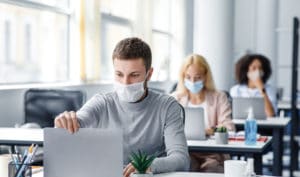 Office workers wearing masks