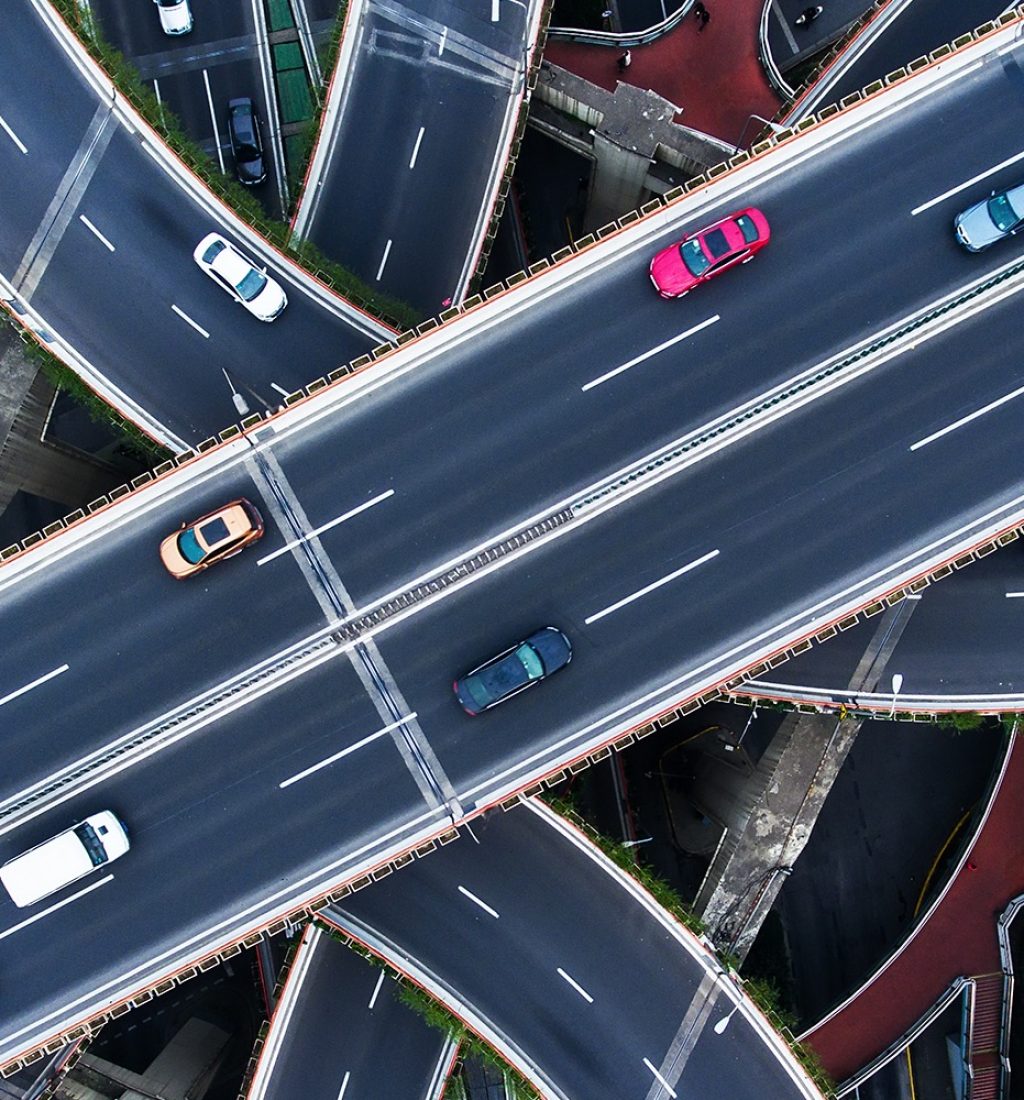 Cars on interconnecting road from above