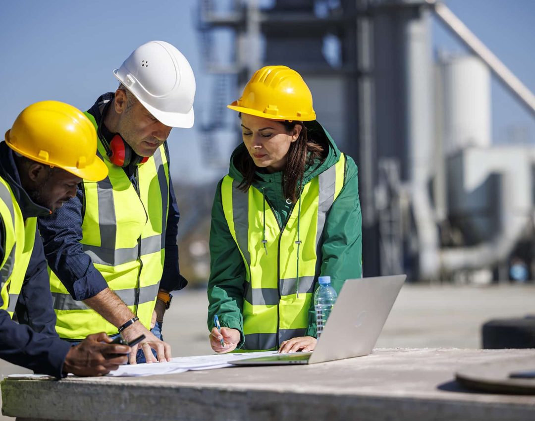 Engineers discussing at industrial facility