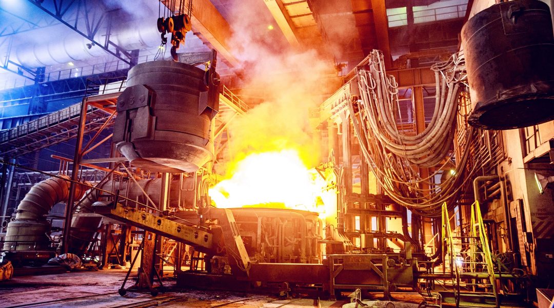 Scrap metal being poured into an Electric Arc Furnace at a Steel Factory