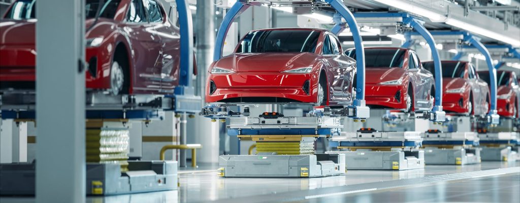 EV Production Line on Advanced Automated Smart Factory. High Performance Electric Car Manufacturing. Car Batteries Installation on Electric Vehicles on Assembly line