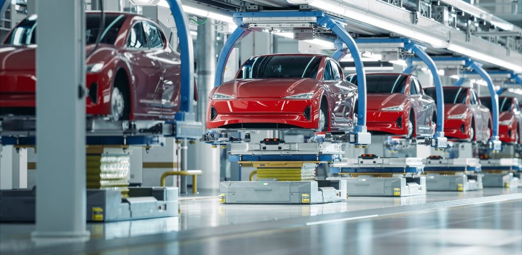 EV Production Line on Advanced Automated Smart Factory. High Performance Electric Car Manufacturing. Car Batteries Installation on Electric Vehicles on Assembly line