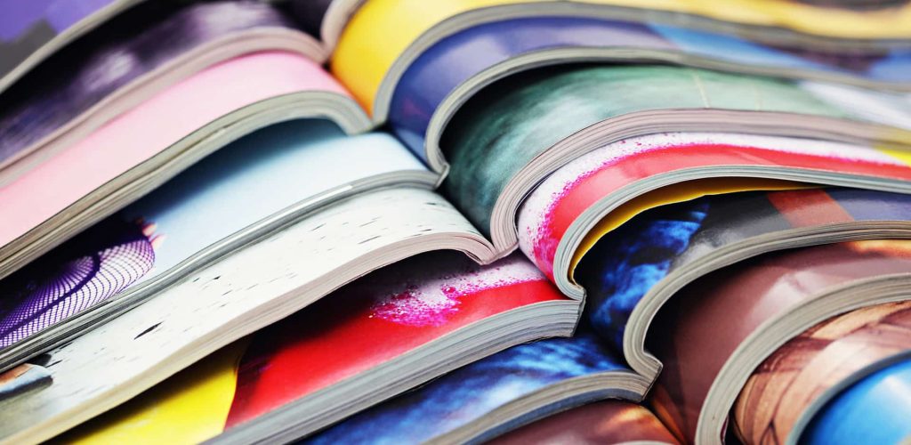 Stack of multi-colour magazines