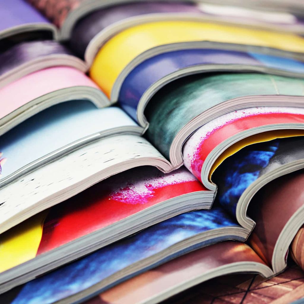 Stack of multi-colour magazines